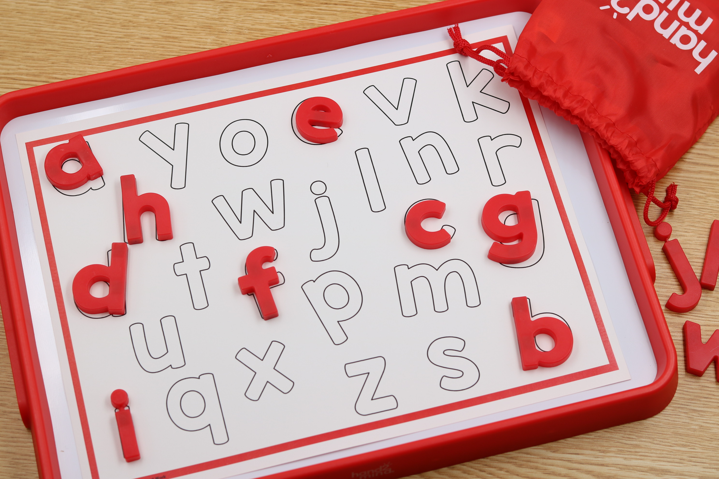 Back-to-school alphabet center featuring lowercase magnetic letters matched to letter outlines for hands-on letter recognition and fine motor practice.