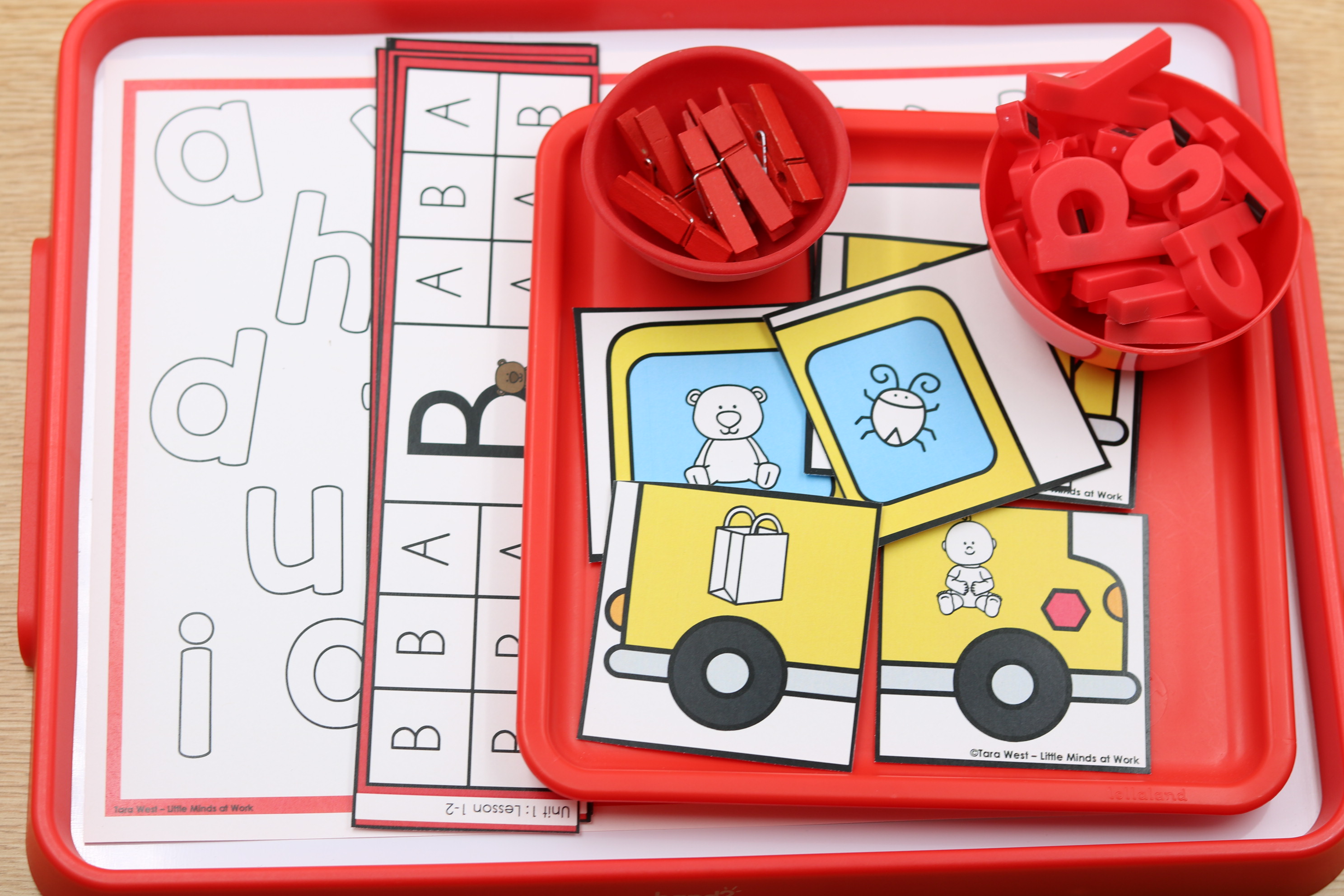 Back-to-school alphabet center featuring beginning sound picture cards, magnetic letters, mini clothespins, and uppercase and lowercase letter recognition activities.