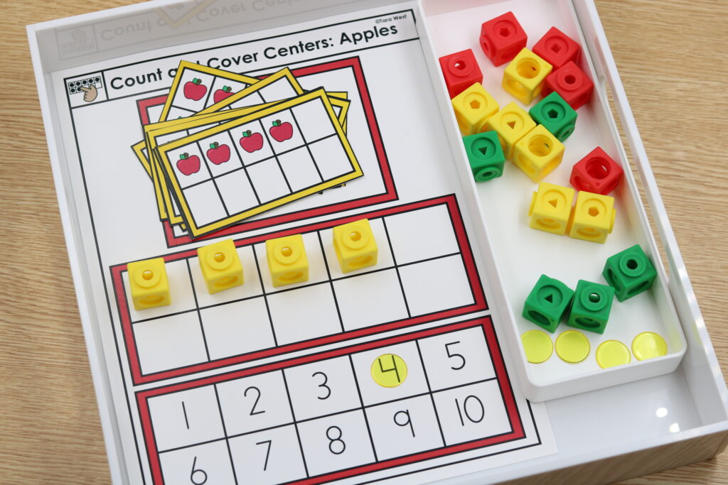 Apple-themed count and cover center using ten frames