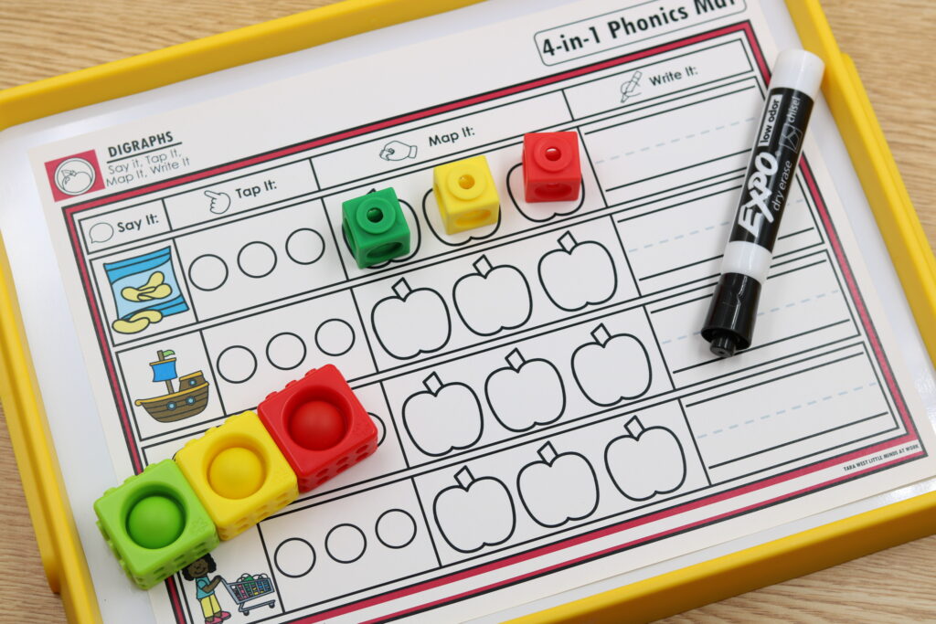 A photo of the digraphs mapping mat with cubes on each phoneme box