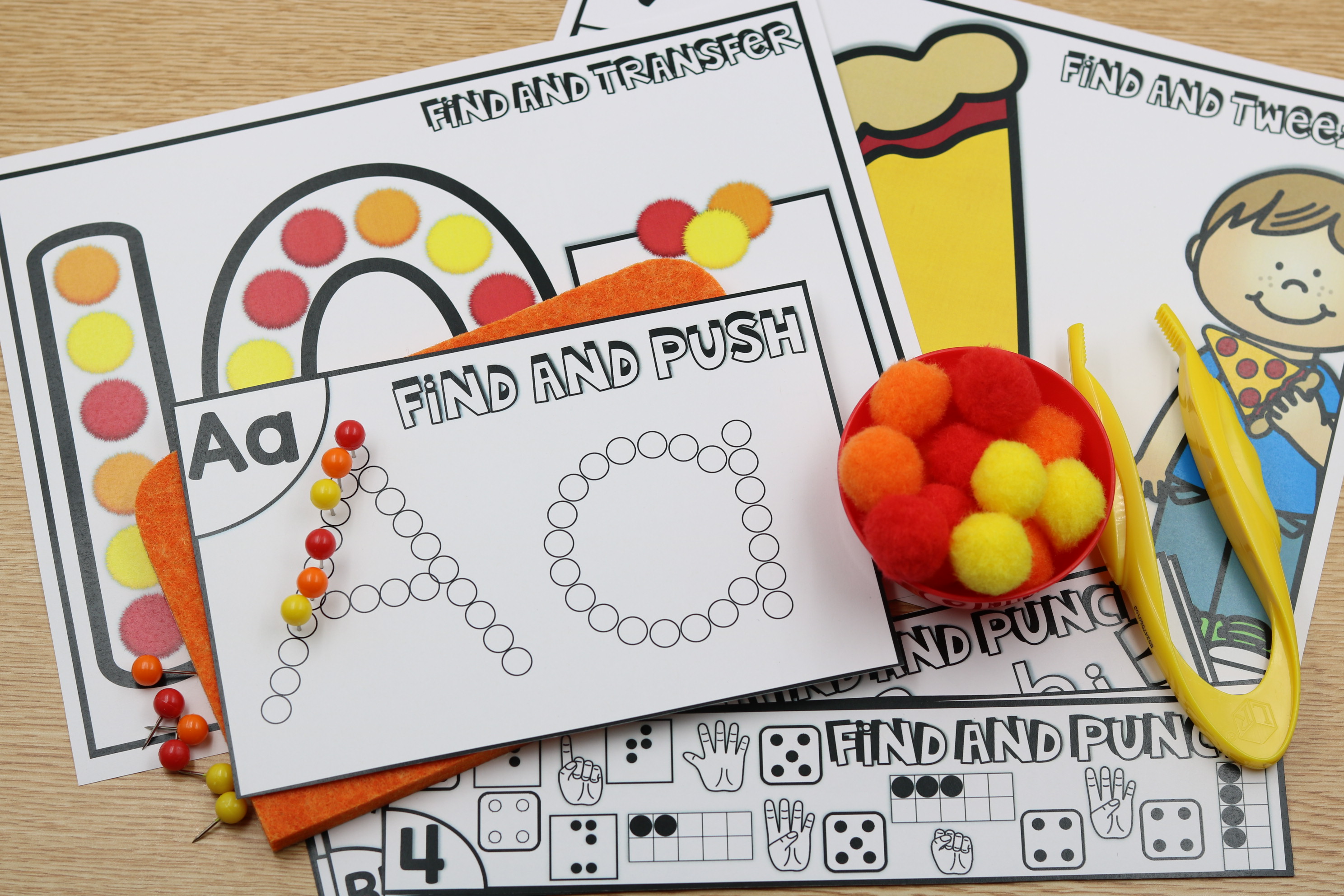 Fine motor centers showing pokey pins, poms, and hole punchers
