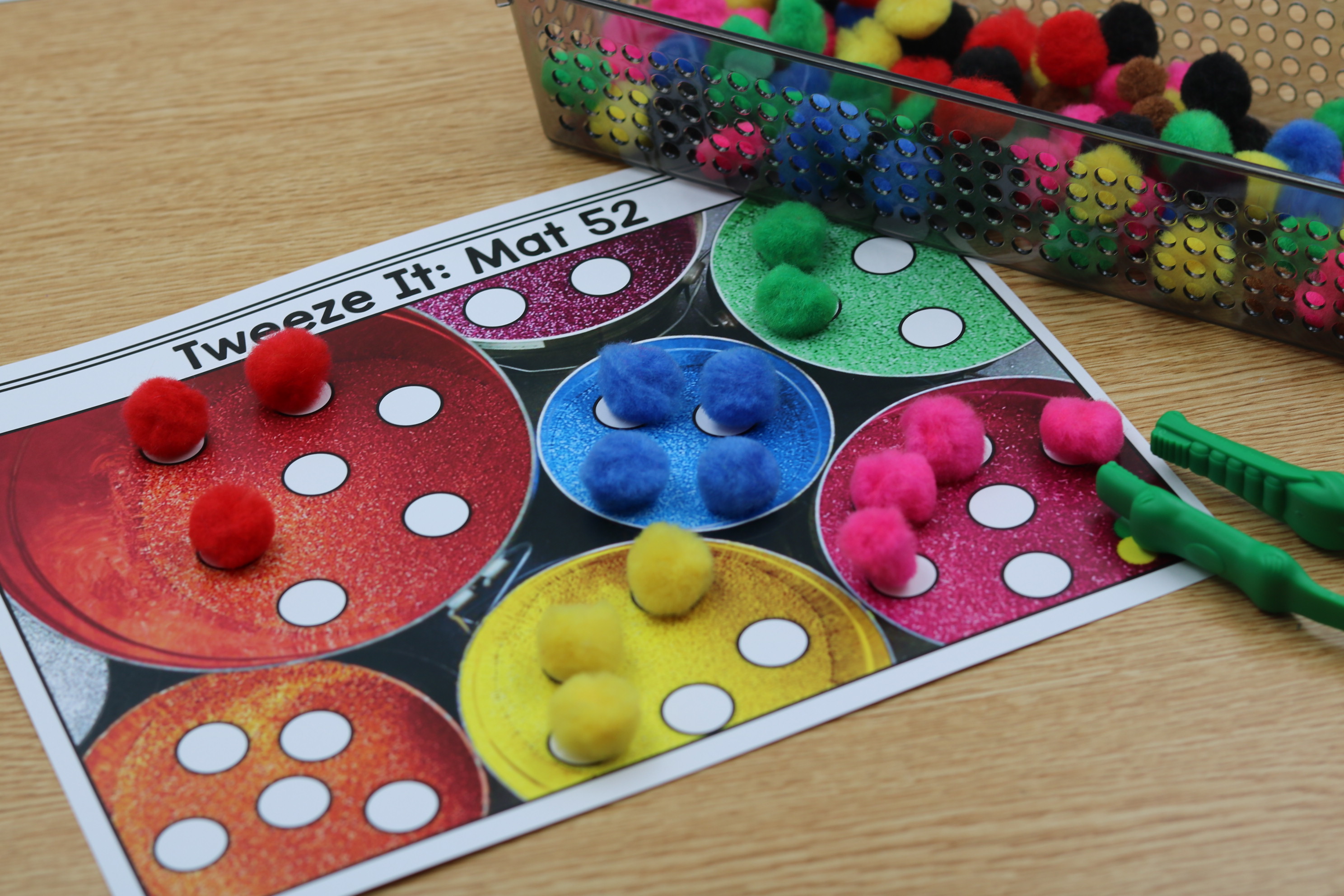 Free fine motor fuzzy pom mats using tweezers.