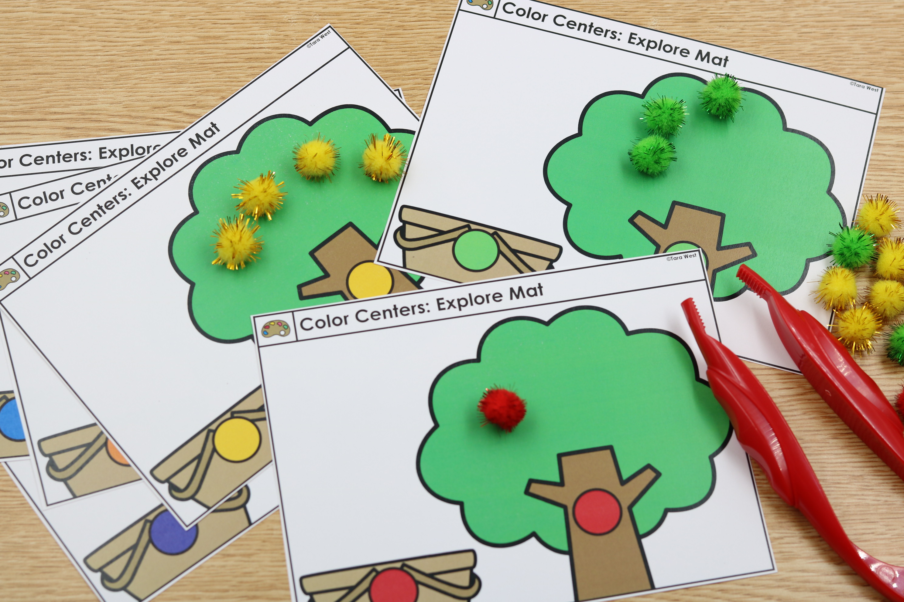 Free fine motor apple pom mats as students use tweezers.