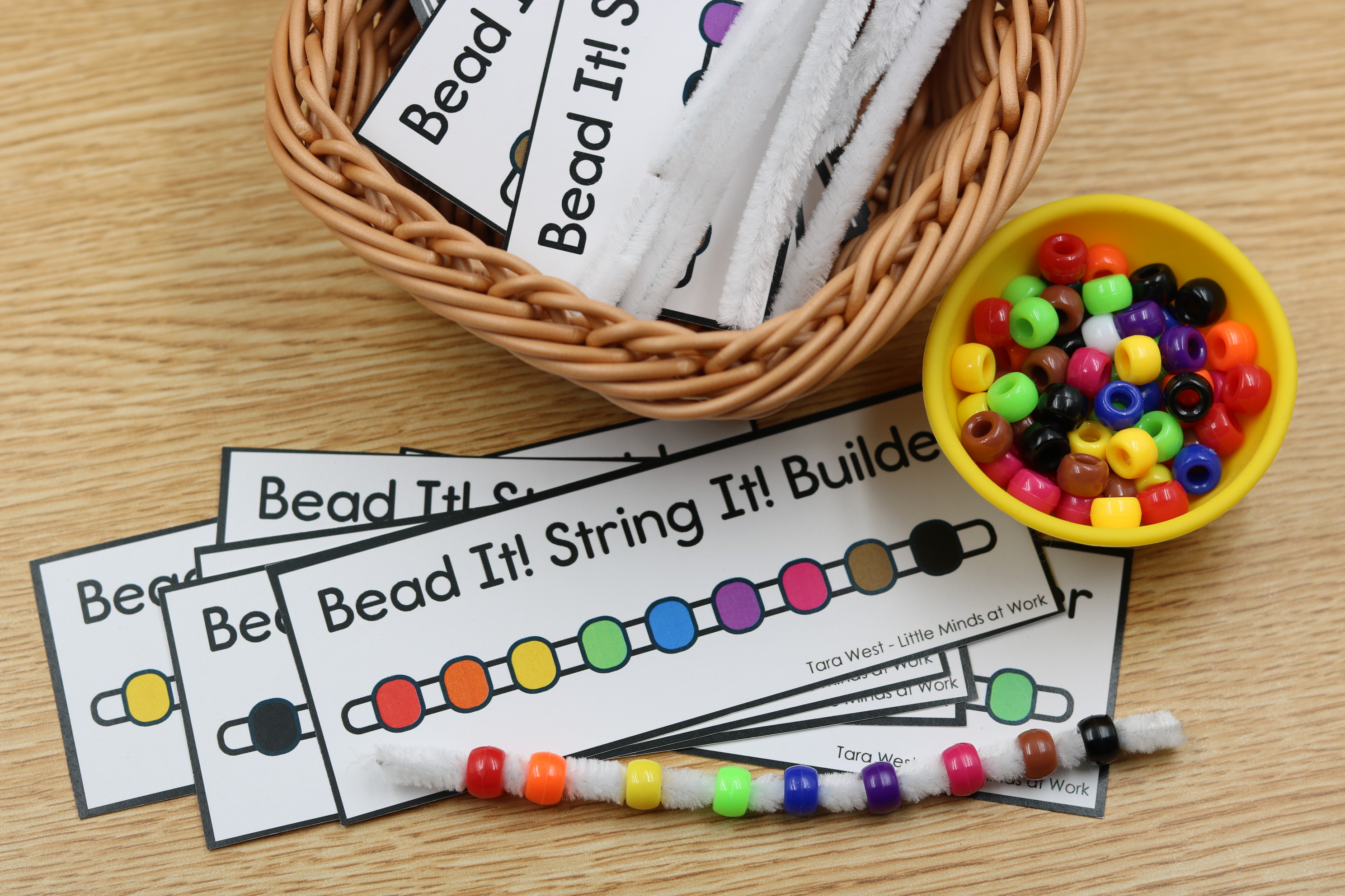 Free fine motor string pony beads on a pipe cleaner