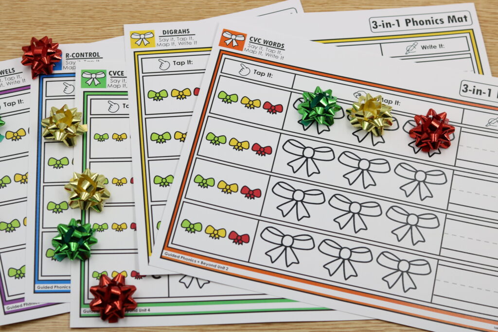 Free December bow-themed mapping mats for Say It, Tap It, Map It, Write It routines