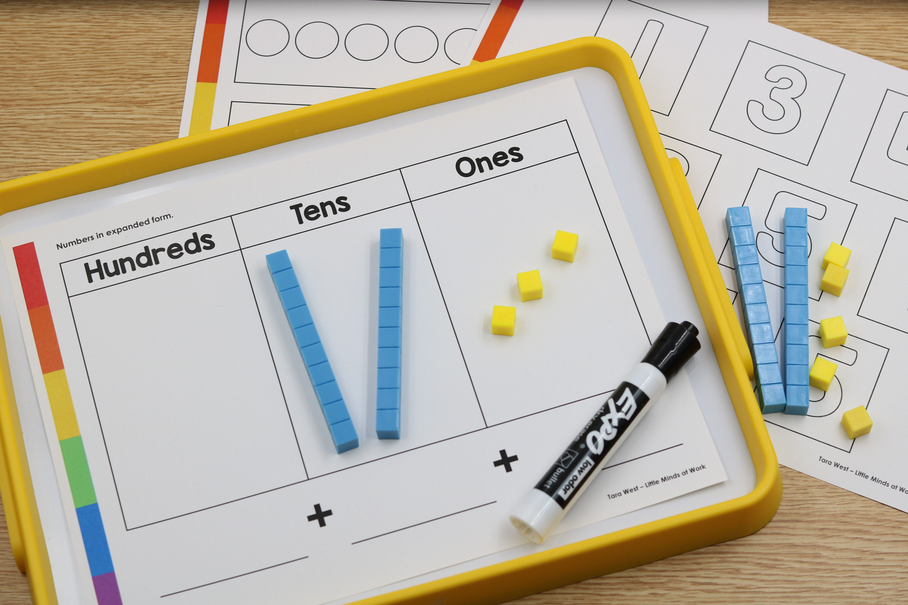 student using hand2mind magnetic boards and the place value number sense mat