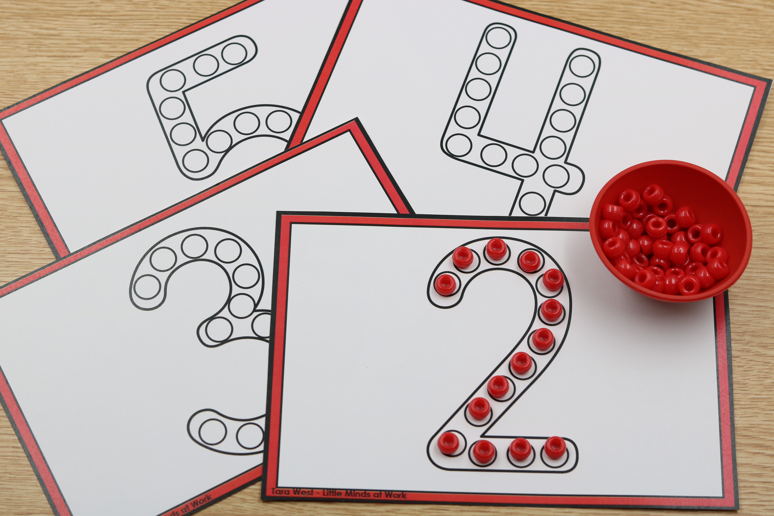 Numbers pony bead builders free download as students build the number 2 with red pony beads.