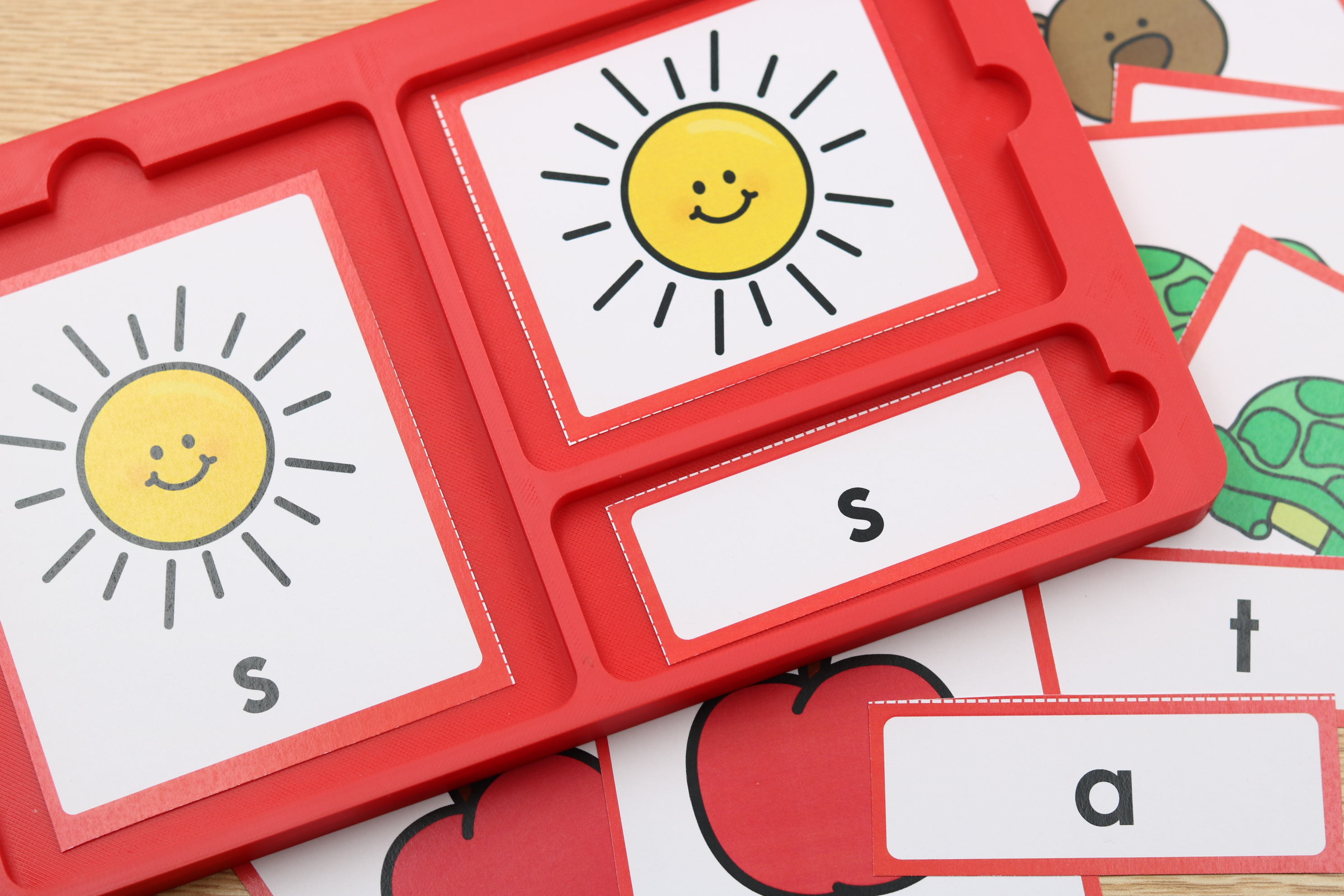 Self-correcting phonics cards organized in a 3-part sorting tray