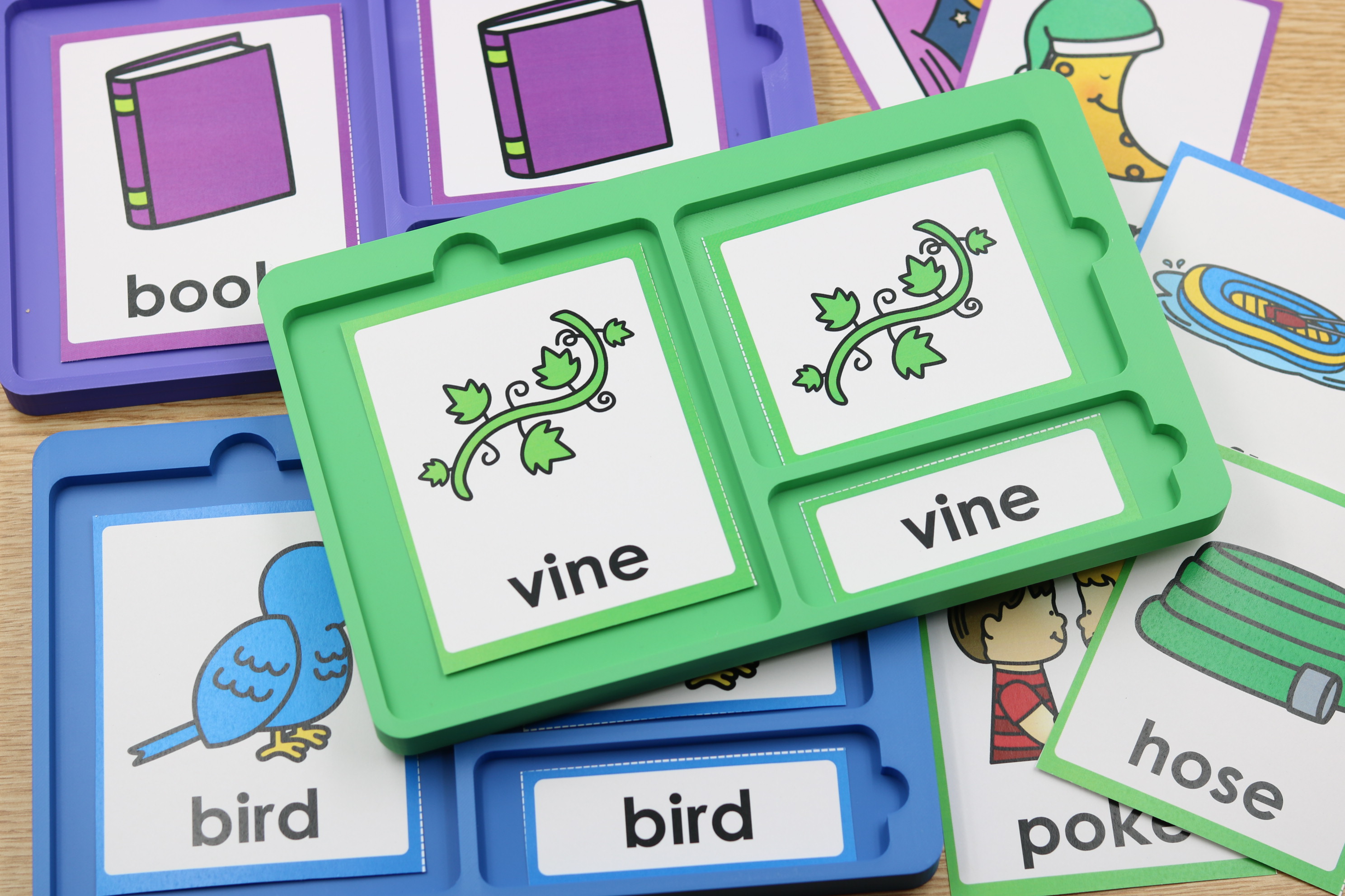 Yearlong phonics literacy centers covering skills from alphabet sounds through vowel variants