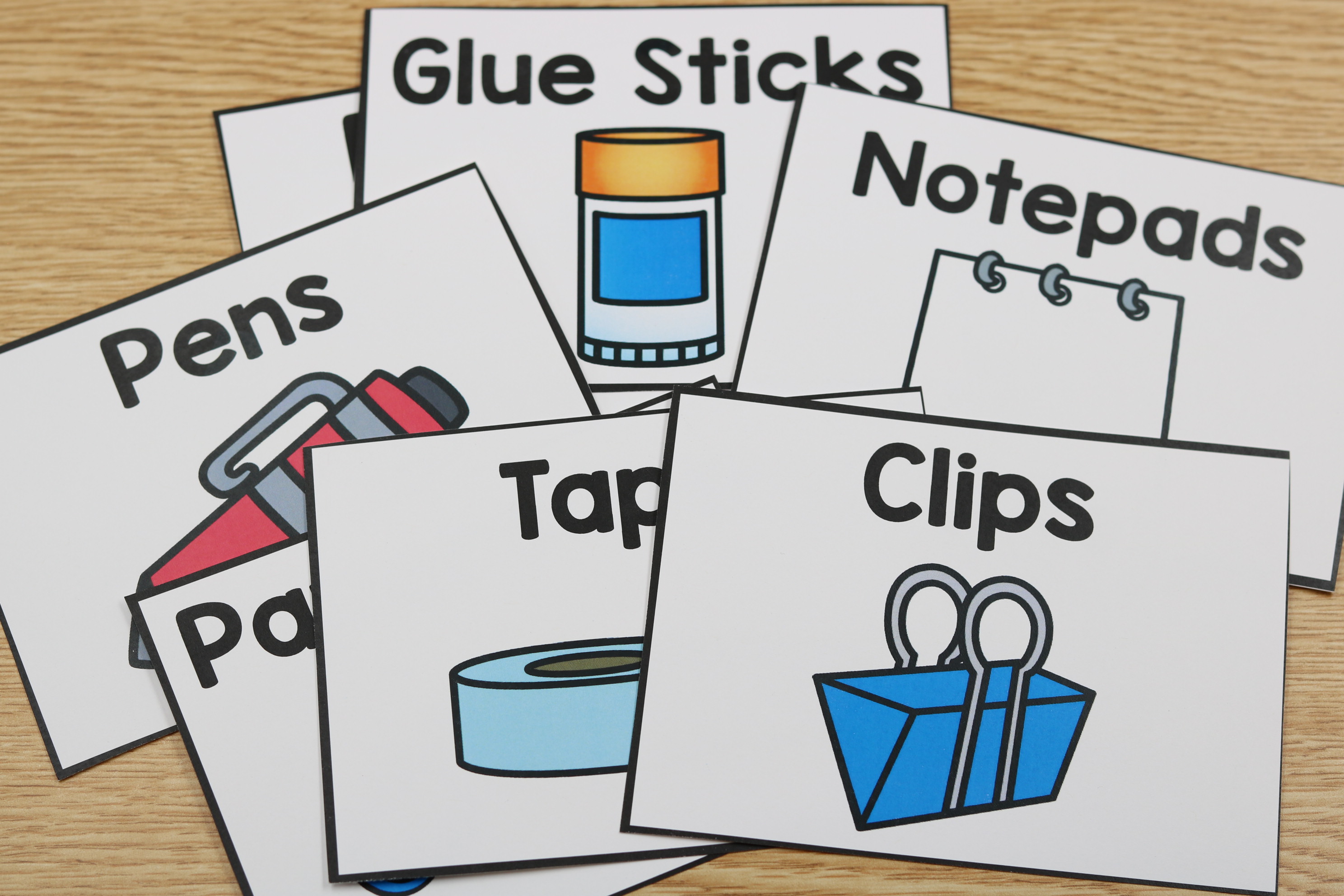 Free classroom supply labels with two color scheme options for organization