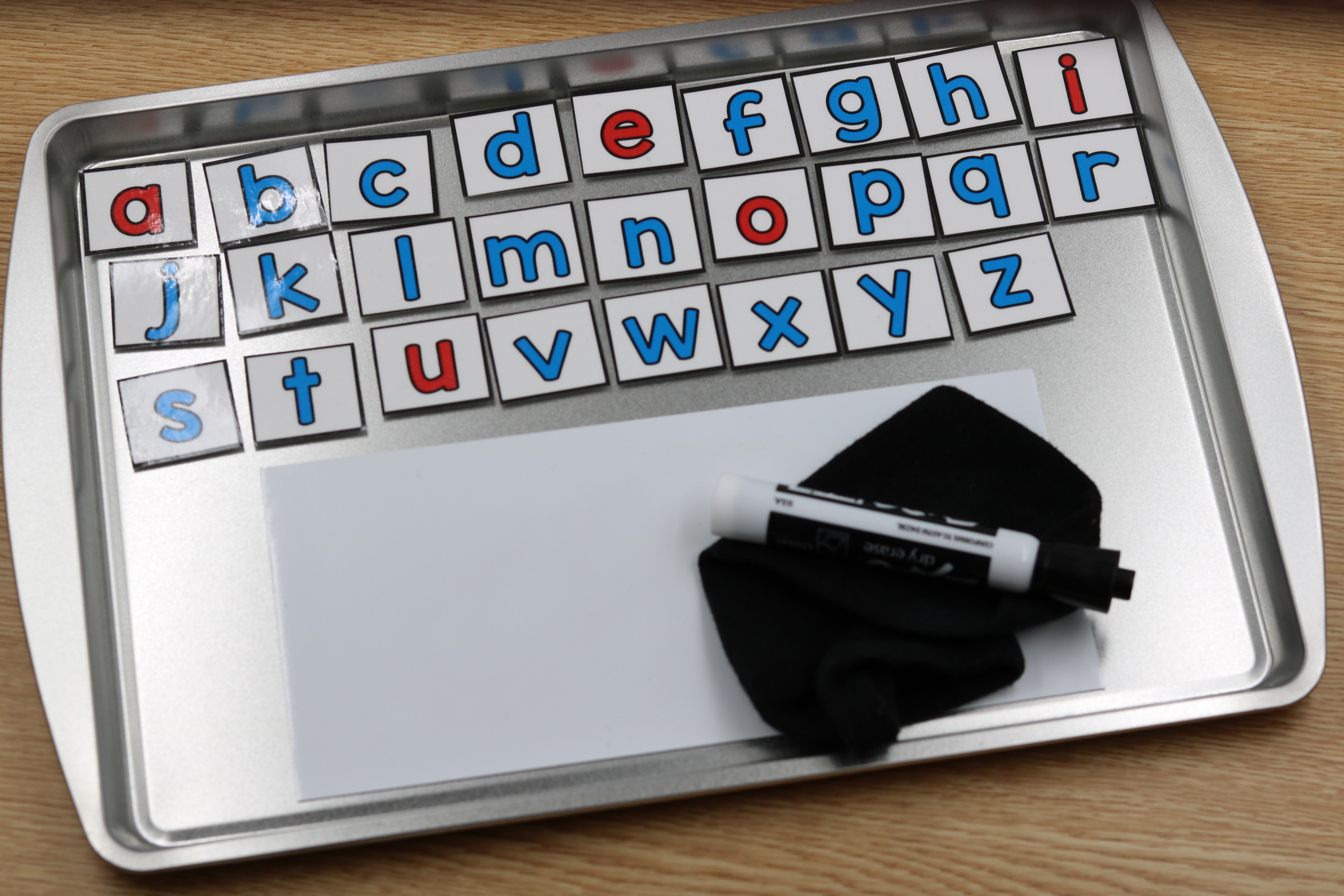DIY printable magnetic letters with button magnets on laminated letters for hands-on phonics use.